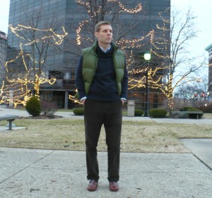 Brown corduroys | Navy sweater | Green vest unzipped