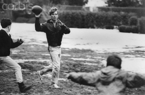 Bobby Kennedy playing football with family