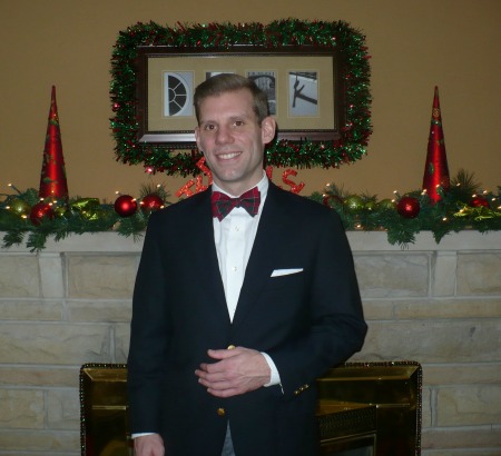 Me in a Holiday Bow tie in font of mantle